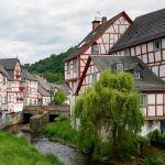 Village Monreal with half timbered houses along creek Eltzbach in the Eifel, Rhineland-Palatinate, Germany