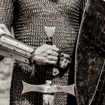 Knight man holding sword and shield. Image in black and white color style