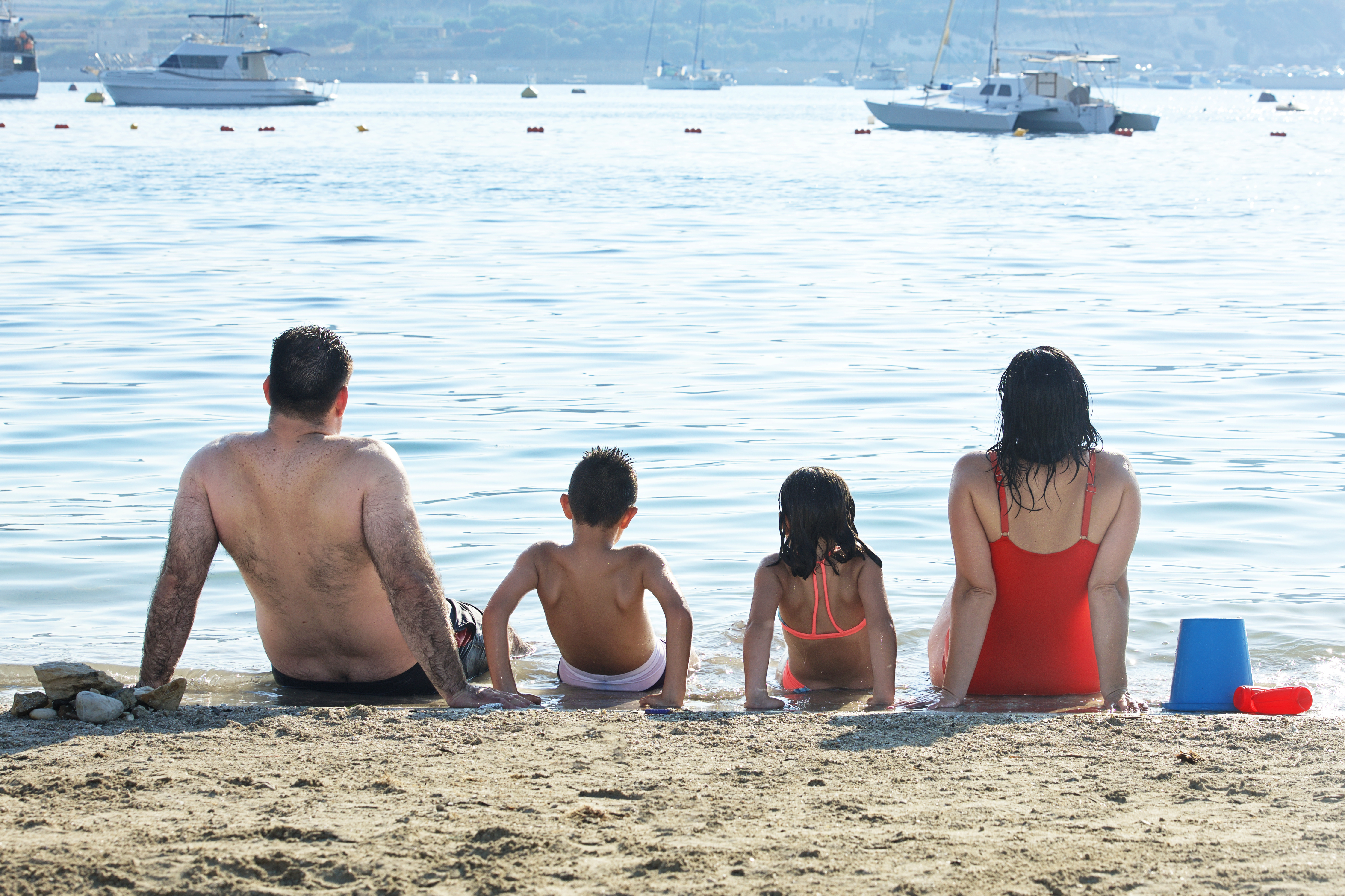 Sicily, Italy_5 may,2018: happy family enjoying near the sea in
